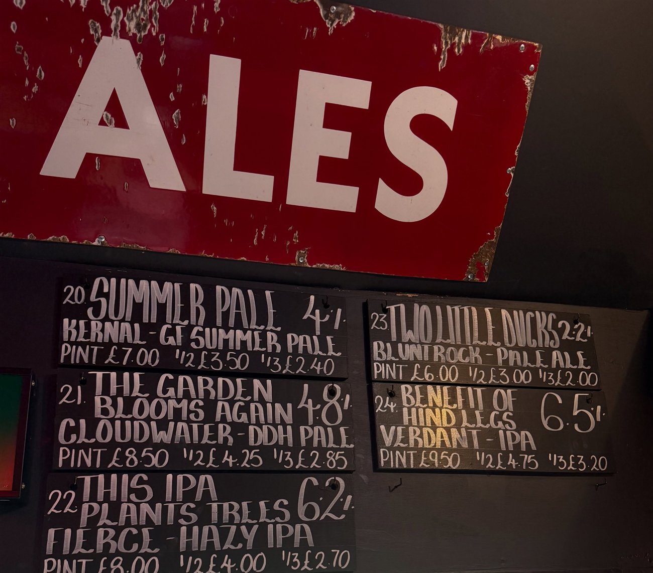 The old Ales enamel sign above the craft beer boards